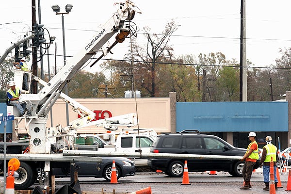 A crew from Diamond Electric of Baton Rouge works at the intersection of Cornerview and Hwy. 61 in Gonzales last week, repairing damage from an apparent lightning strike.