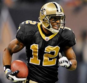 New Orleans Saints wide receiver Marques Colston runs with the ball.