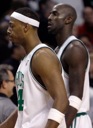 Celtics forwards Paul Pierce (left) and Kevin Garnett walk off the court on Friday night.