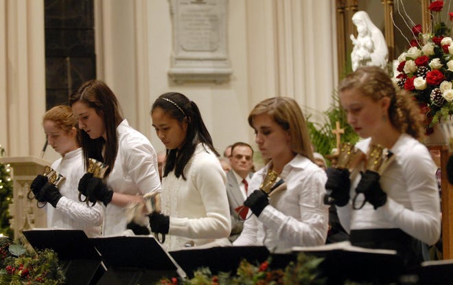 Members of the High School Handbell Choir play "Carol of the Bells" Sunday, Dec. 20, 2009 at the 30th Annual Festival Service of Lessons and Carols at the Cathedral of St. Patrick in Norwich.