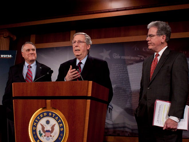 Senate Minority Leader Mitch McConnell, R-Ky., speaks to reporters at a news conference where he was joined by Sen. Jon Kyl, R-Ariz., left, and Tom Coburn, R-Okla., on Capitol Hill in Washington, Sunday.