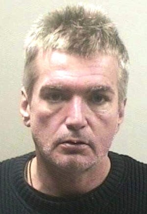 David E. Walsh of Quincy is accused of assaulting police after shouting racial epithets at a truck driver in Quincy.