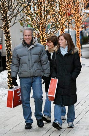In this Dec. 22, 2009 photo, holiday shoppers look for some bargains in New York. Last-minute shoppers are out in force, but most of the buying is done and presents wrapped.