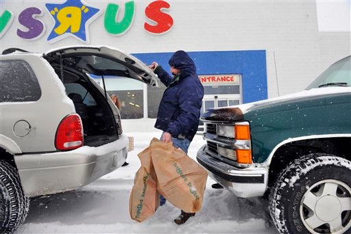 In this Dec. 20, 2009 file photo, Raymond Brockmann, of North Attleboro, Mass., shops at a Toys "R" Us store in North Attleboro. Toys R Us said about 300 stores in the East Coast will stay open 6 a.m.- 1 a.m. through Wednesday, Dec. 23,, and would be open 6 a.m.-9 p.m. on Christmas Eve. Stores in other parts of the country will be open until midnight and will be open until 8 p.m. on Christmas Eve.