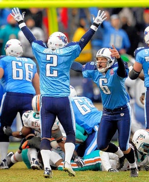 Tennessee Titans place kicker Rob Bironas (2) celebrates his 46-yard field goal in overtime to beat the Miami Dolphins 27-24 last Sunday.