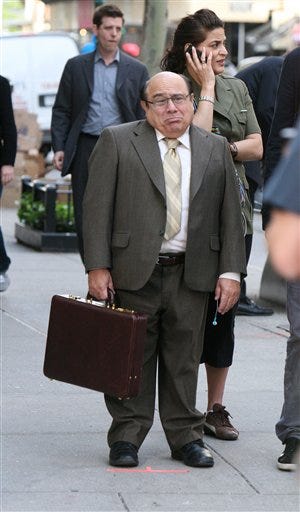 In this May 7, 2008 file photo, Danny DeVito films a scene from the feature film "When in Rome" on Madison Avenue in New York. On Wednesday, Dec. 23, 2009, New York City began imposing a $3,200 fee to film in city buildings, which the city says will affect only about 5 percent of filming done citywide.