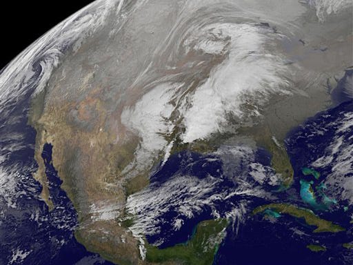This image provided by NOAA taken at 3:45 a.m. EDT Thursday Dec. 24, 2009 shows a major winter storm lumbering across the nation's midsection promising a white Christmas for some. "It's an unusually large storm, even for the Plains," according to Scott Whitmore, a National Weather Service meteorologist in Topeka. The worst of the storm was expected to hit the region Thursday and Friday, bringing heavy snow, sleet and rain to a large swath of the Plains and the Midwest. A foot or two of snow was possible in some areas by Christmas Day.