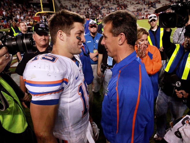 Florida's Tim Tebow and Gator head coach Urban Meyer following the Gators 24-14 victory over the University of South Carolina in Columbia Saturday, November 14, 2009.