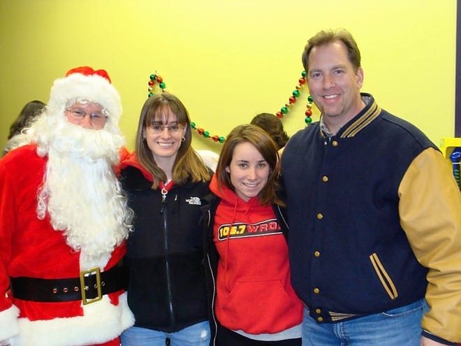 Pictured from left are Santa Claus, Kara Foley, Nora Jordan, and Hank Morse.