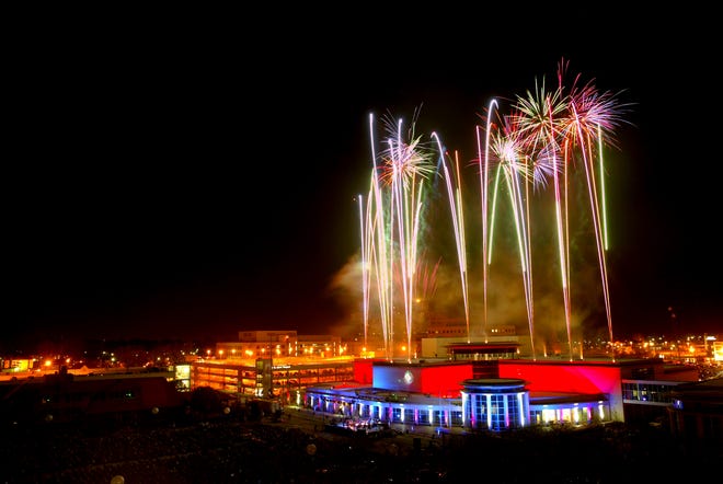 As the 312th Army Band plays, fireworks explode in the air over the Abraham Lincoln Presidential Museum during the Fireworks and Laser Spectacular that celebrated the Museums opening.