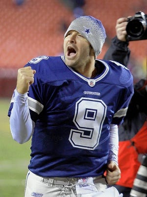 Cowboys quarterback Tony Romo celebrates after Dallas' 17-0 victory over Washington on Sunday.