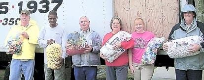 FCTC staff load a Minorcan Moving and Storage truck with bottle caps collected for a local 6-year-old with leukemia, Morgan Blakley. From left: Ron Hitchcock, Gene Glass, Carl Edenfield, Teresa Woodward, Jennifer Spess and Dan Jones. Contributed photo