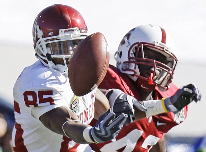 Oklahoma's Ryan Broyles had three TD catches and set a single-game school mark with 13 catches in the Sun Bowl.