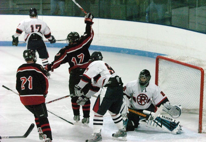 Whitman-Hanson's Brennan Lenane (17) celebrates his team's first goal during the Panthers' 6-3 victory over Pembroke on Saturday at Hobomock Arena.