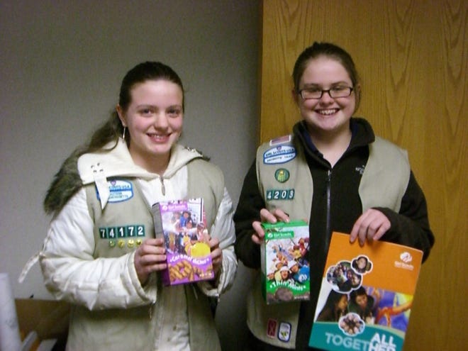 Leah Cox and Emily Devane, both 14, of Quincy, sold more than 500 boxes of Girl Scout cookies last year.