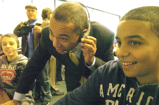 Gov. Deval Patrick listens to a spelling program with seventh-grade student Ruben Goncalves during a visit to South Middle School in Brockton and the classroom of Jessica Sweeney.