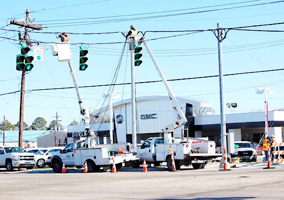 A crew works Wednesday morning at the intersection of Hwy. 44 and Hwy. 30 in Gonzales where a new turn lane will be next to the Duplessis dealership. The traffic project is one of many currently underway throughout the city.