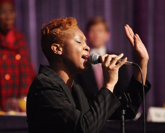 JON M. FLETCHER/The Times-UnionAkia McDaniel sings "Lift Ev'ry Voice and Sing", also know as the black national anthem, to open the 23rd annual Martin Luther King Jr. Breakfast at the Prime Osborn Convention Center on Friday.