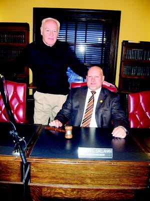 Town of Manchester Supervisor Jeff Gallahan, right, a new member of the Ontario County Board of Supervisors, has some family ties on the county board. His brother-in-law, Richard Hyde, left, was Hopewell supervisor in the 1990s. The gavel in front of Gallahan was used by his great-uncle, Ben Brown, Manchester supervisor from 1924 to 1931.