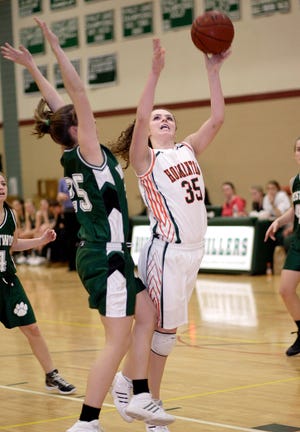 Hopkinton's #35 Alee Leteria tries to go up for 2 on Westwood's #25 Kerri Harrington in Friday night's game at Hopkinton H.S.