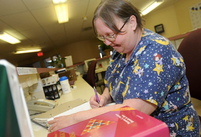 Mary Kuhlemeier, L.P.N fills out charting on residents at the Stephenson County Nursing Center Friday, Jan. 8, 2010.