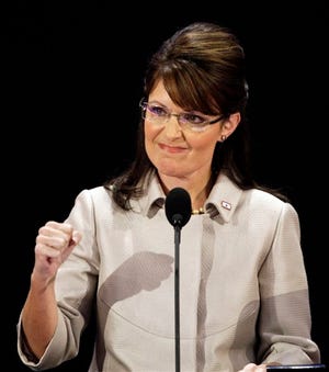 In this Sept. 3, 2008 file photo, Republican vice presidential candidate, Alaska Gov. Sarah Palin, pumps her fist during her speech at the Republican National Convention in St. Paul, Minn. Palin believed that Sen. John McCain chose her to be his running mate in 2008 because of "God's plan," according to a top political strategist in the Arizona Republican's campaign.