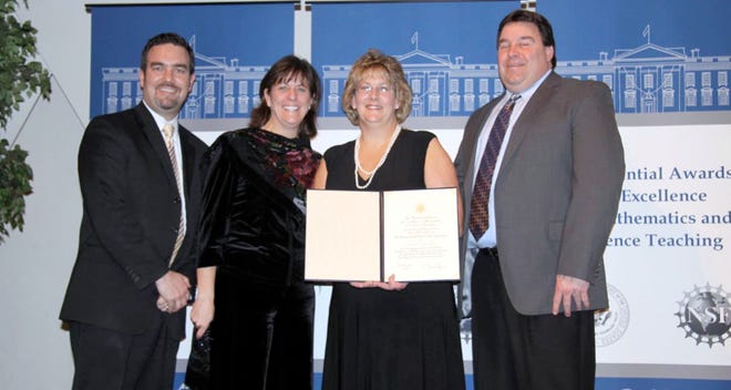 First-grade teacher Debbie Seaver, of Brookside Elementary School in Milford, last week was honored at the National Academy of Sciences as a recipient of a Presidential Award for Excellence in Mathematics and Science Teaching. She received the honor during a ceremony in Washington, D.C., on Wednesday. As a winner, she received $10,000 and the all-expenses-paid trip. "The most exciting part of the trip was seeing and meeting President Obama," Seaver said. "I also had the opportunity to meet and speak with a lot of teachers from across the country and attend workshops and conferences. It was a very rewarding experience and one that I will never forget." Superintendent Robert Tremblay and Brookside Principal Kathleen Kay attended the ceremony with Seaver and her husband, Paul. Seaver thanked her husband, parents, Frederick and Mary Maffia, and her sons Paul, 20, and Daniel, 16. Pictured, from left, are Tremblay, Kay, Debbie Seaver and Paul Seaver.