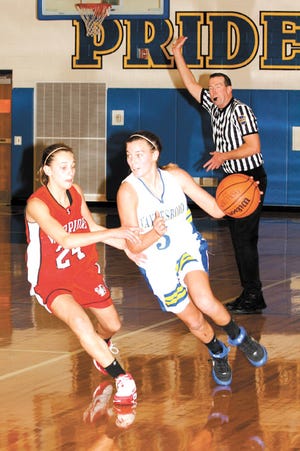 Waynesboro's Dani Miller tries to drive around Susquehannock's Leah Deter, who is whistled for a foul.