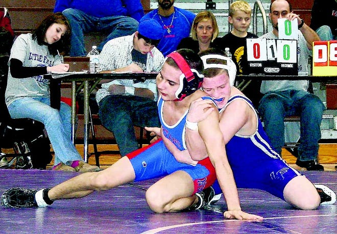 Little Falls Mountie Matt Herringshaw earns his first points with a takedown of New Hartford’s Brandon Delmonte (left) Saturday afternoon. Herringshaw earned Most Outstanding Wrestler honors for his team at the Little Falls Duals.
