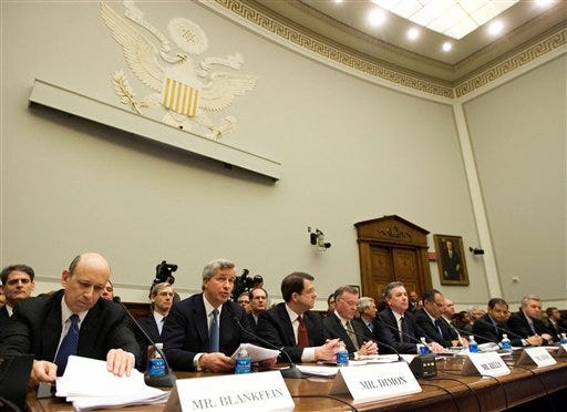 In this Feb. 11, 2009 file photo, from left, Goldman Sachs & Co. Chief Executive Officer and Chairman Lloyd C. Blankfein; JPMorgan Chase & Co. Chief Executive Officer James Dimon; Bank of New York Mellon Chairman and Chief Executive Officer Robert P. Kelly; Bank of America Chairman and Chief Executive Officer Ken Lewis; State Street Corporation Chairman and Chief Executive Officer Ronald E. Logue; Morgan Stanley Chairman and Chief Executive Officer John Mack; Citigroup Chief Executive Officer Vikram Pandit, and Wells Fargo & Co. President and Chief Executive Officer John Stumpf, testify on Capitol Hill in Washington, before the House Financial Services Committee. President Barack Obama is weighing a levy on financial institutions to help recover shortfalls in a $700 billion bank bailout fund and to help balance a budget that is looking increasingly grim amid an ongoing economic crisis. (AP Photo/Manuel Balce Ceneta, File)
