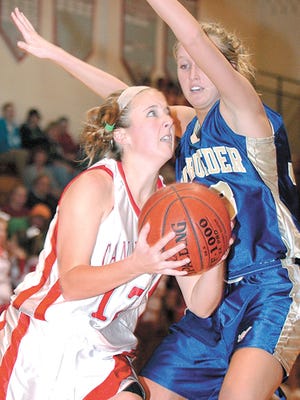 CA's Stacy Wade (13) goes against Schroeder's Haley Lindahl (33) at CA on 1/12/10.