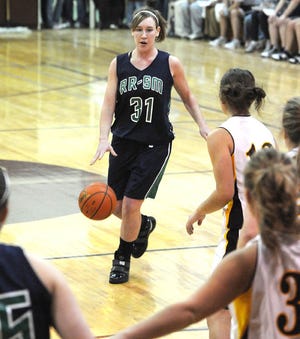 River Ridge/Scales Mound's Whitney Keiffer brings the ball up-court against Stockton Monday night.