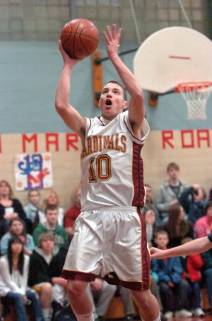 Cardinal Spellman's Mike Patti scores a basket on a layup in the first half.