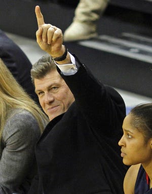 Connecticut Head Coach Geno Auriemma gestures to the Marquett fans in the second half of a NCAA college basketball game Wednesday, Jan. 13, 2010, in Milwaukee. Connecticut won 68-43.(AP Photo/Jeffrey Phelps)