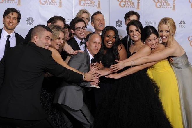 The cast members of "Glee" share the award for best series, musical or comedy.