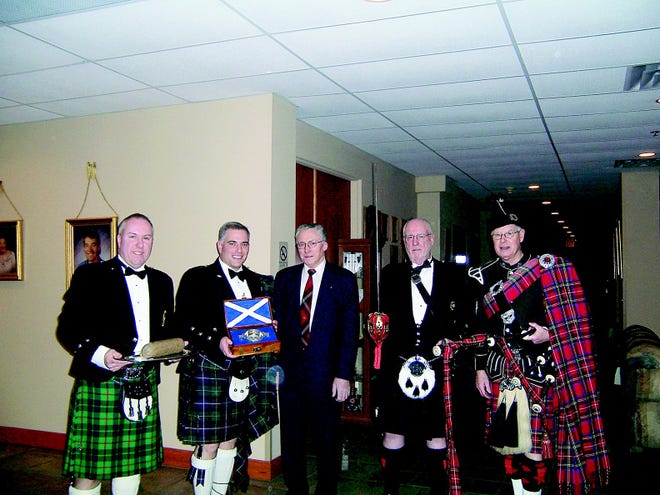 The Rochester Scottish Heritage Society will be celebrating its 16th annual Roberts Burns Night this Saturday at Brook-Lea Country Club. The ceremony includes a procession, as pictured last year. Craig Barclay, left, is the haggis bearer; Bob McNeill, quaich bearer; Alan Ramsay, poem reciter; Charlie Hancock, sword bearer; and Les Carr, piper.