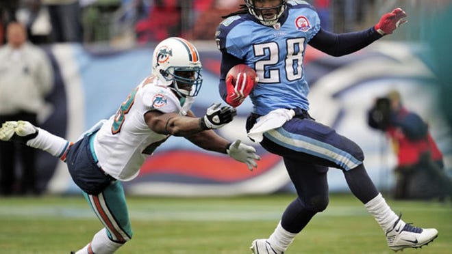 In another big play against the Dolphins, Titans running back Chris Johnson gets past a diving Gibril Wilson.
