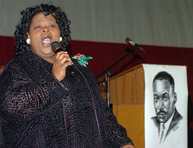 Sheryl "Dottie" Pressley-Harper sings during the Dr. Martin Luther King Jr. Celebration held Edward "Peel" Coleman Community Center in Canton.