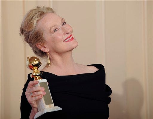 Meryl Streep poses with the award for best actress in a motion picture, comedy or musical for "Julie and Julia" at the 67th Annual Golden Globe Awards.