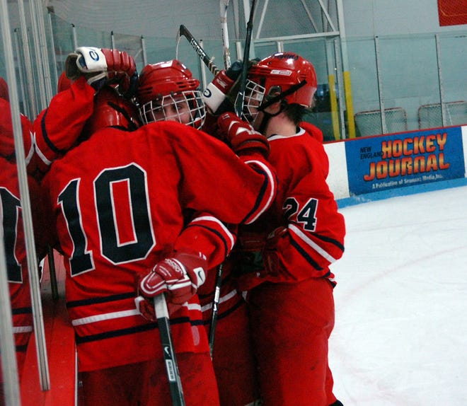 Bridgewater-Raynham players celebrates a second-period goal during the Trojans' 5-3 victory over Whitman-Hanson on Monday.