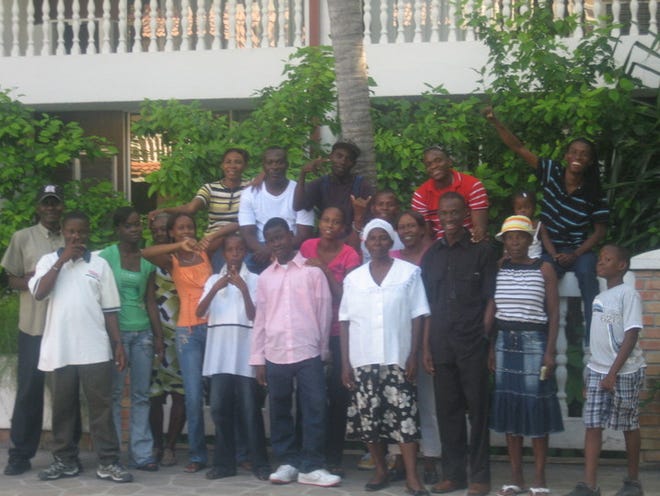 Jean-Jacob Jeudy, bottom row third from right, visited Haiti last year and got to see all of his siblings.