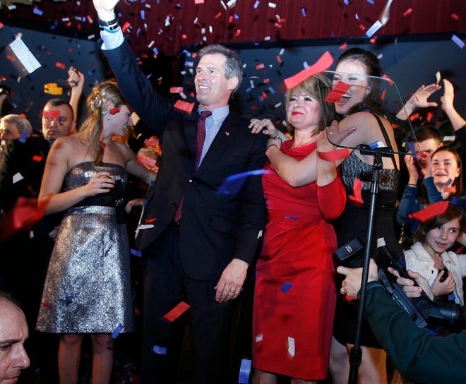 Sen.-elect Scott Brown with family Arianna (left) his wife Gail Huff and Ayla (right) celebrate on stage at the Park Plaza in Boston.