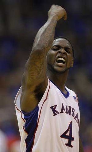 Sherron Collins celebrates after hitting a key 3-pointer in KU's give-and-take fight with Baylor on Wednesday night in Allen Fieldhouse. Collins had 28 points in the Jayhawks' 81-75 victory.