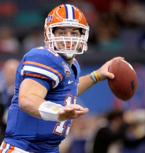 Former Florida quarterback Tim Tebow throws a pass during the Sugar Bowl. After playing four seasons with the Gators, Tebow, a former star at Nease High School, will see how he does in the NFL. Scouts aren't sure what to make of Tebow. Some say that he's a first-round pick, while others say he could drop to the third or fourth round. The Associated Press