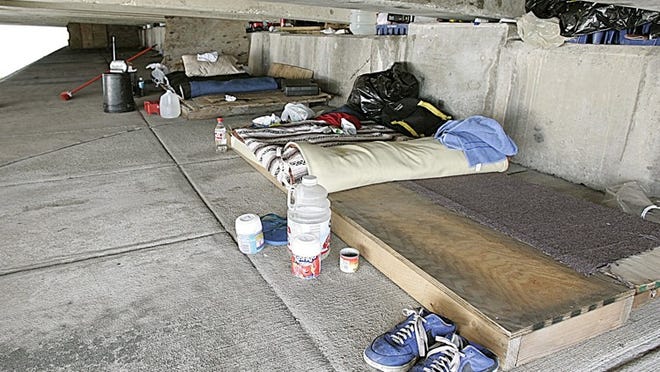 The living areas of two paroled sex offenders living under a bridge beside the intercoastal waterway in Miami is seen Thursday, April 5, 2007. The men live under the bridge because they can not find housing in compliance with the strict county ordinances that limit where they can live. (AP Photo/J. Pat Carter) ORG XMIT: MH106