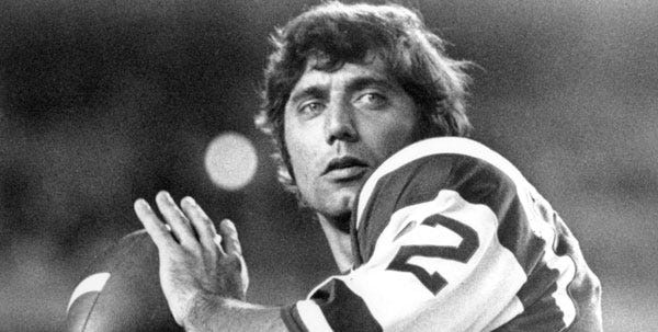 FILE - In this Jan. 1970, file photo of New York Jets quarterback Joe Namath warms up before a game. Namath was asked if he'll be in Indianapolis for the Jets' biggest game since Namath put the franchise on the map 41 years ago. He croons from the musical "West Side Story": "When you're a Jet, you're a Jet all the way."