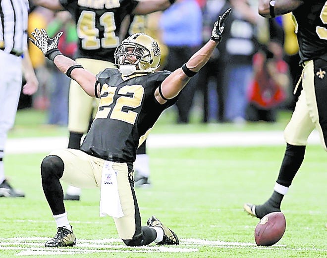 New Orleans cornerback Tracy Porter celebrates after intercepting a pass by Minnesota's Brett Favre during the fourth quarter of the NFC Championship game Sunday in New Orleans. By BILL HABER, The Associated Press