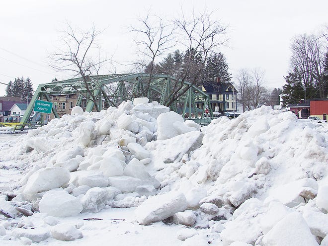 ICE CHUNKS WERE PILED near the banks on the Fulton County side of the East Canada Creek.