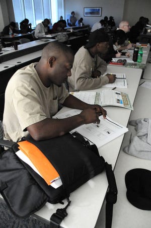 BRUCE LIPSKY/The Times-UnionAustin Burrell takes notes during the EPA Hazardous Materials Incident Response Operation class at Florida State College at Jacksonville. Stimulus money is helping train people to work in that field.