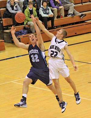 Petoskey’s Joe Keedy, left, and Sault High’s David Deuman (22) compete for a rebound during Tuesday’s game.